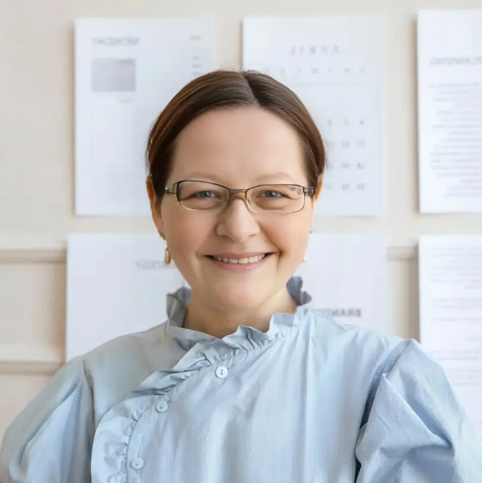 JLR Bookkeeping founder in office setting with financial documents in background
